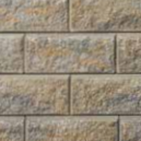 Marbled gray and tan split faced retaining wall block.