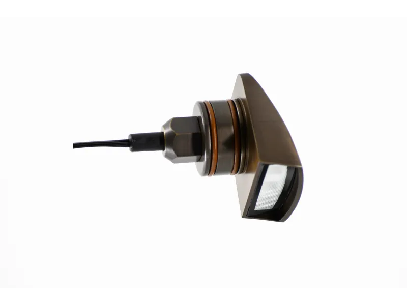Side view of the Lumien Lighting 3000K fully integrated brass fixture, featuring an antique finish and compact design for outdoor lighting.